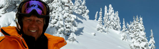 Skier looking down moutain ski run